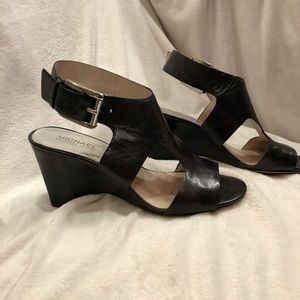 Michael Kors black leather wedge sandals.